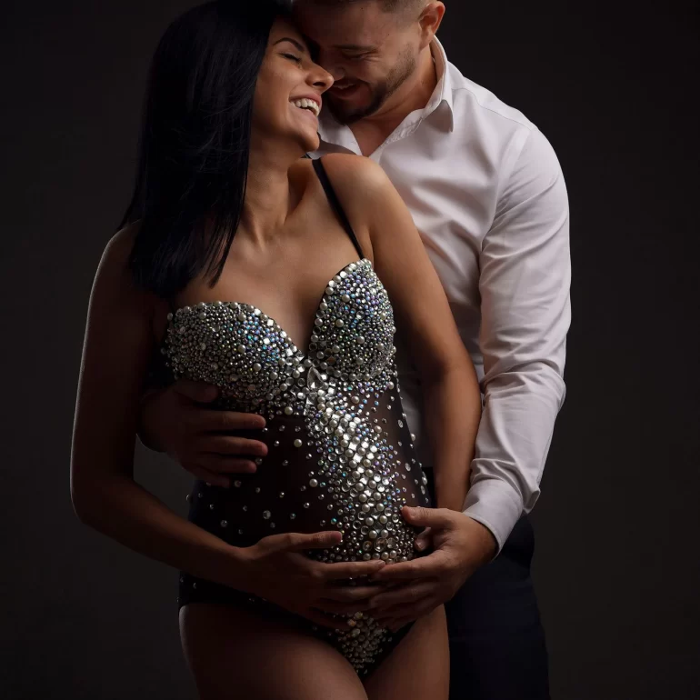 Maternity Photoshoot in North West London 19 Laughter‑filled couple’s portrait; jewel bodysuit and crisp white shirt.