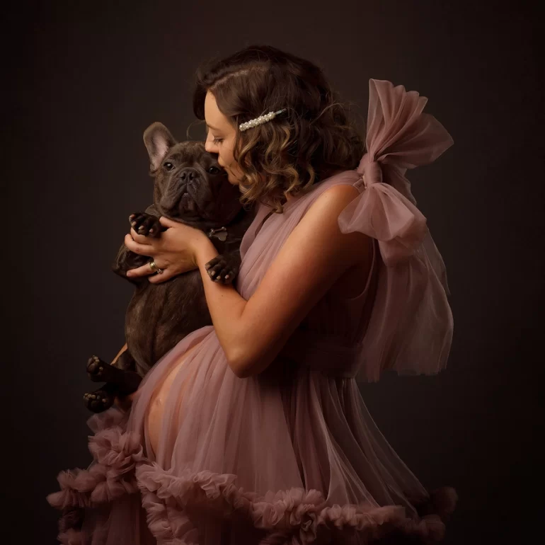 Maternity Photoshoot in North West London 21 Expectant mother cuddling French Bulldog; soft curls and pearl hair clip.
