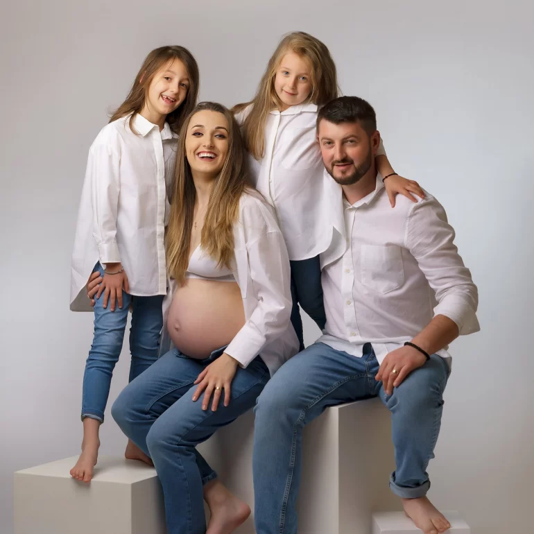 Maternity Photoshoot in North West London 38 Family in white shirts and jeans; relaxed, joyful connection.