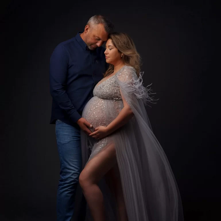 Maternity Photoshoot in North West London 53 Silver embellished gown with sheer cape; intimate couple’s embrace.