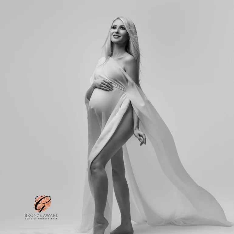Maternity Photoshoot in North West London 18 Sheer white drape; long lines and upward gaze in minimalist studio.