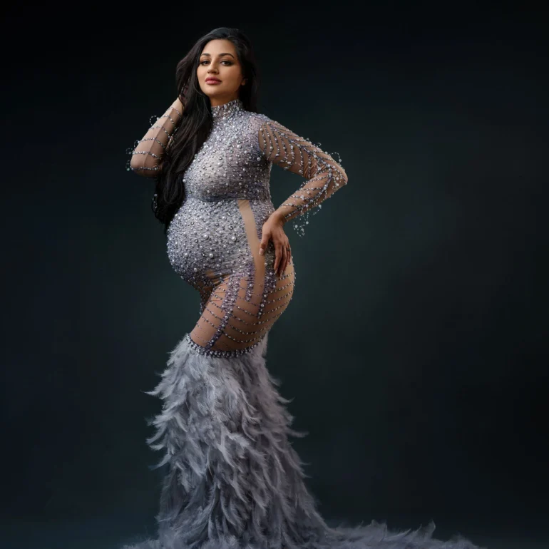 Maternity Photoshoot in North West London 70 Sparkling, form‑fitting gown with feathered hem; poised confidence.
