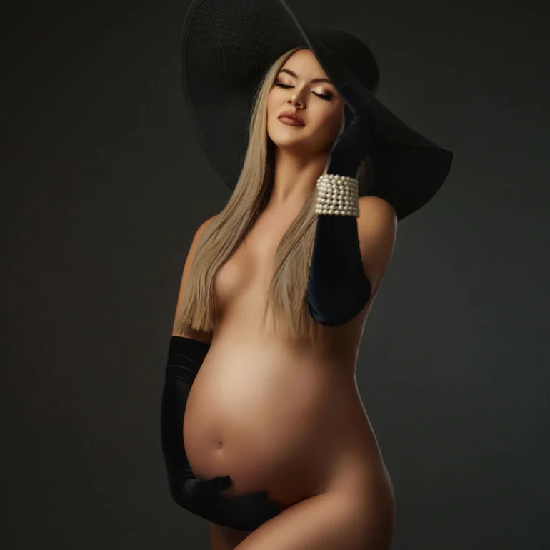 Maternity Photoshoot in North West London 78 Long black gloves and hat; minimalist dark background; classic lines.