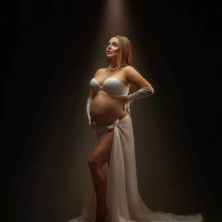 Maternity Photoshoot in North West London 86 Spotlight on white gloves, pearls, and sheer fabric; classic elegance.