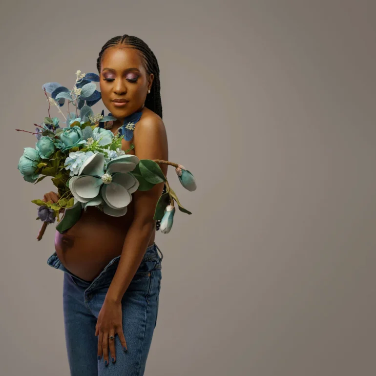 Maternity Photoshoot in North West London 82 Unbuttoned jeans with pastel bouquet; natural, relaxed beauty.