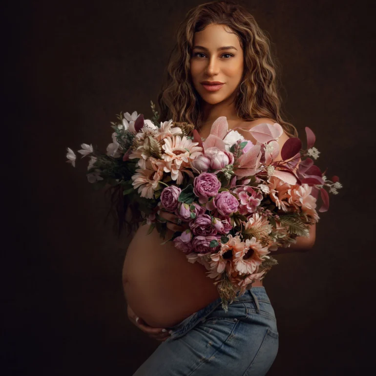 Maternity Photoshoot in North West London 94 Blue jeans and bouquet of pink and peach blooms; warm studio feel.
