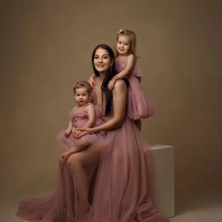 Family & Portrait Photoshoot in North West London 45 Mother in blush gown with two daughters in matching pink dresses; warm studio light.